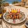 Plateau de fruits de mer Le Royal Océan avec huîtres, crevettes, bulots, langoustines, pinces de tourteaux et tourteau entier par L’Écailler de Stef